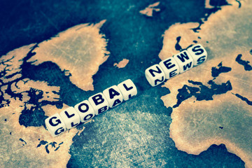 GLOBAL NEWS on grunge world map, vintage