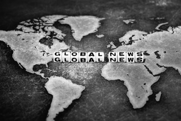 GLOBAL NEWS on grunge world map, black and white
