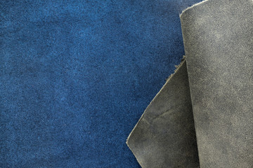 Close up fold grain grey and navy blue leather texture backgroun