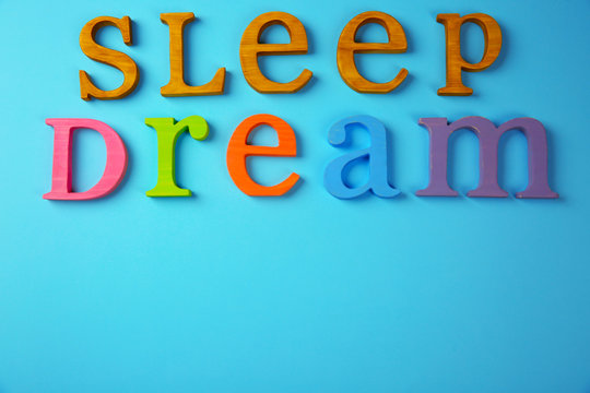 Text SLEEP DREAM on blue background