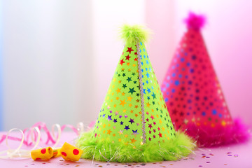 Party hats on bright background