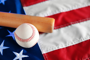 Baseball and bat on background of American flag. Popular sport concept