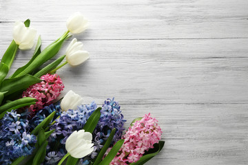 Bouquet of hyacinth and decor on wooden background