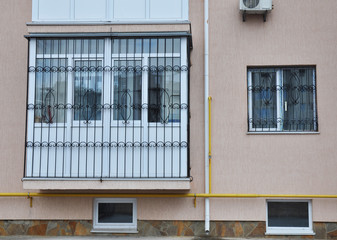 KIEV, UKRAINE - FEBRUARY, 5, 2016: Close up on window iron security bars installation. Windows...