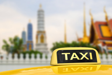taxi sign with bangkok temple background