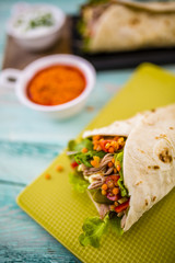 Tortilla with pulled pork, fresh vegetables