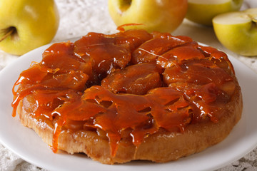 Apple Tarte Tatin with caramel close-up on a plate. horizontal
