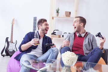 Handsome young guy are resting at home