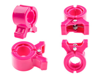 red plastic paperclip isolated on white