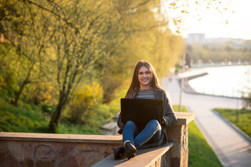 beautiful girl with a laptop and coffee