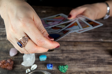 Fortune teller woman predicting future from cards
