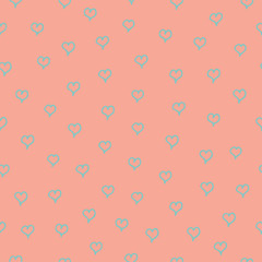 Seamless pattern with blue hearts on pink background.