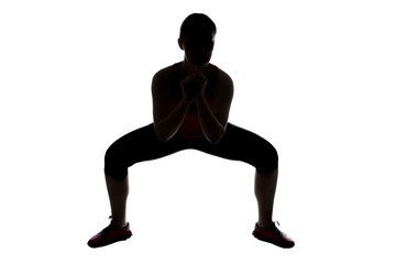 Silhouette of woman, squats sumo