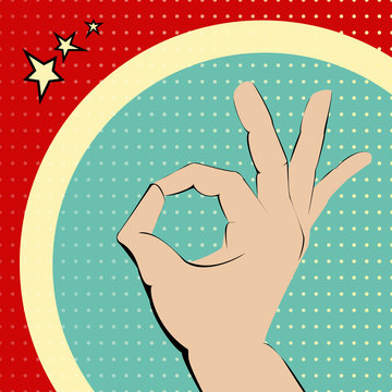 Ok hand on red and turquois spotted background.
