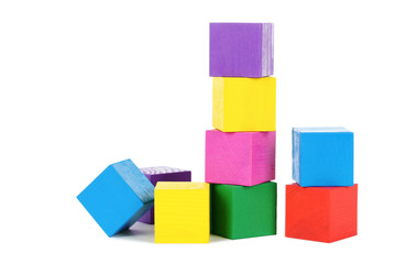 Colorful wooden toy cubes isolated on a white