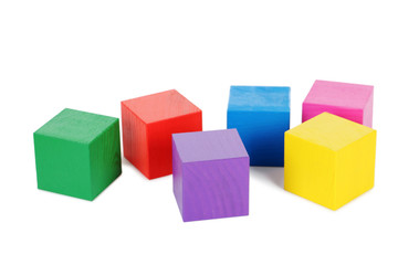 Colorful wooden toy cubes isolated on a white
