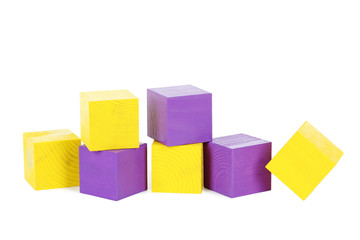 Colorful wooden toy cubes isolated on a white