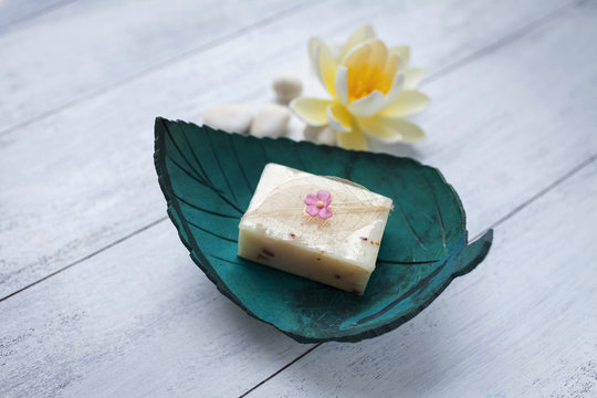 Natural hand soap bar on leaf shape coconut shell soap dish