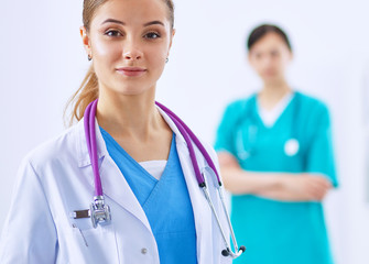 Woman doctor standing with stethoscope at hospital