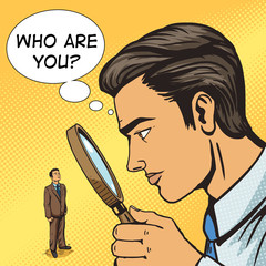 Man looking through magnifier on man pop art