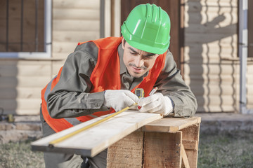 Contractor operating a power tool
