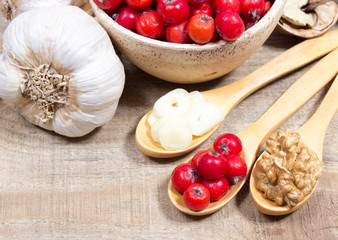 Fresh fruit of hawthorn, garlic and walnuts. The concept of alternative medicine.