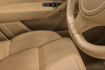 Obraz premium Airbag sign on steering wheel of car. Modern auto interior detail.