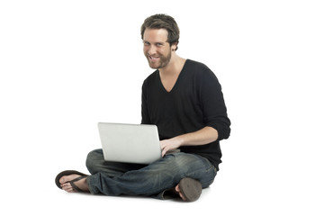 a happy man using a laptop