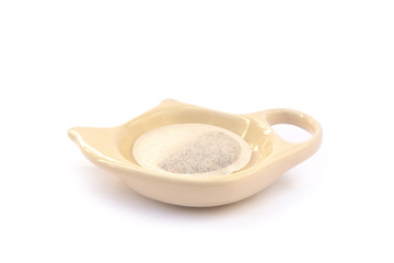 Tea on the tea saucer isolated on white background