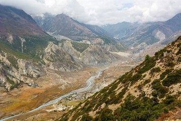 Fototapeta premium River flowing through a mountain valley in Nepal.