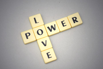 words love and power on a gray background