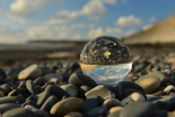 Beach ball, U.K. A crystal ball on a beach. - obrazy, fototapety, plakaty
