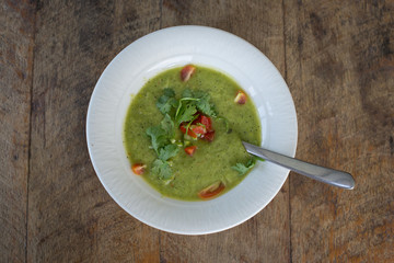 Soup gazpacho on wooden table, close up