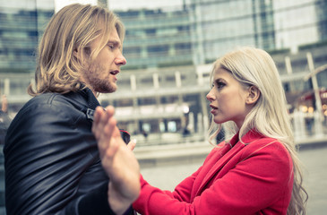 Couple fighting in an urban area of the city