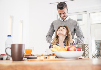 Couple sharing love moments at breakfast