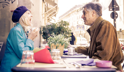 Fototapeta na wymiar Senior couple having a coffee in a bar