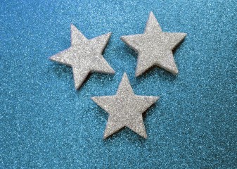 Fototapeta na wymiar three stars on illuminated background