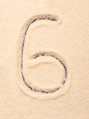 6 number written on sand