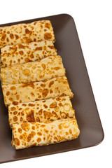 Russian Stuffed Blintzes Isolated on White. Selective focus.