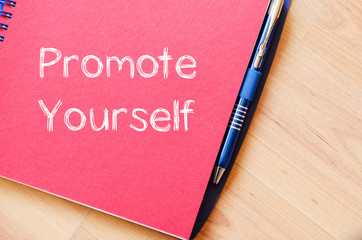 Promote yourself write on notebook - 108280606