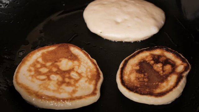 process of cooking the fritters for breakfast 
