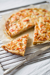 Tomato cheese pie on white background