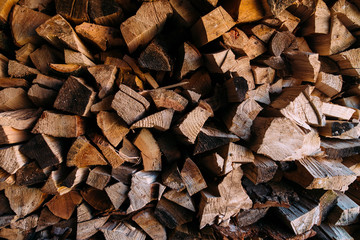 Pile of firewood. Preparation of firewood for the winter. Background