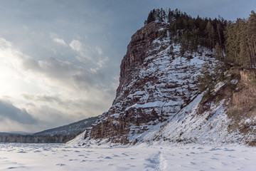 cliff towering above the river Irkut