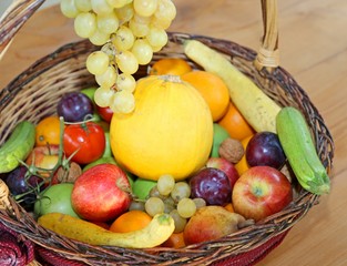 wicker basket with fresh fruit in autumn