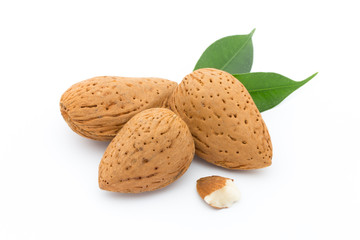 Almonds with leaves isolated on white background