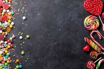 Colorful candies, jelly and marmalade over stone