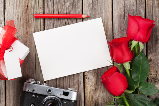 Valentines day roses, photo frame and camera