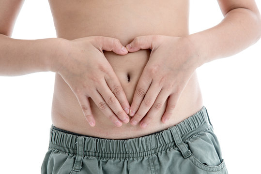Boy's hands on stomach
