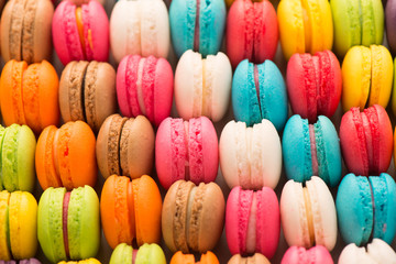 Colourful tasty macaroons in a row